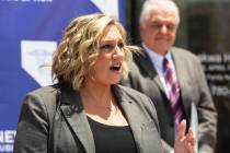 File - State Majority Leader Nicole Cannizzaro speaks as Gov. Steve Sisolak looks on, on Wednes ...