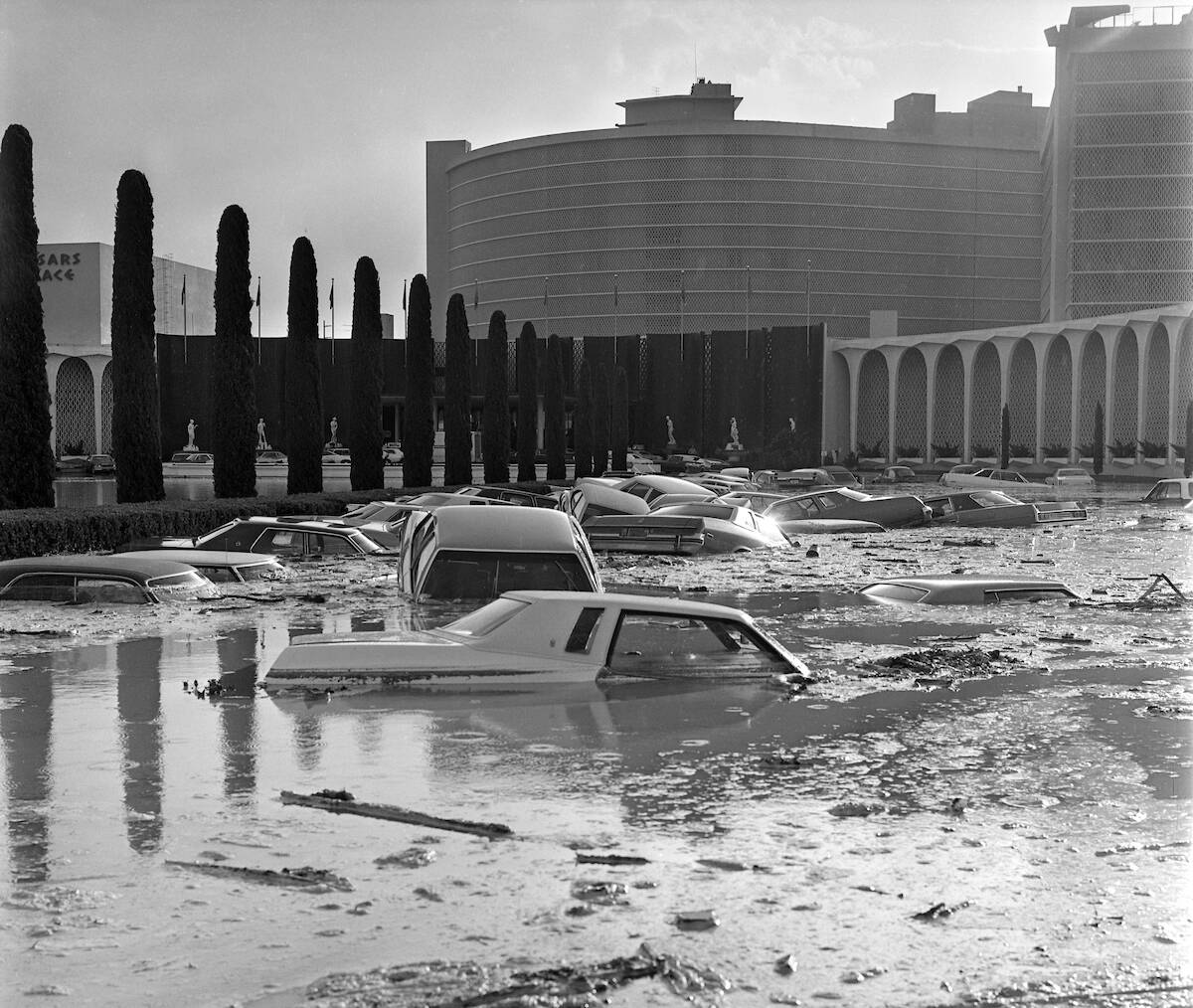 Floo waters sink cars and fill the Caesars Palace parking lot during a flash flood July 3, 1975 ...