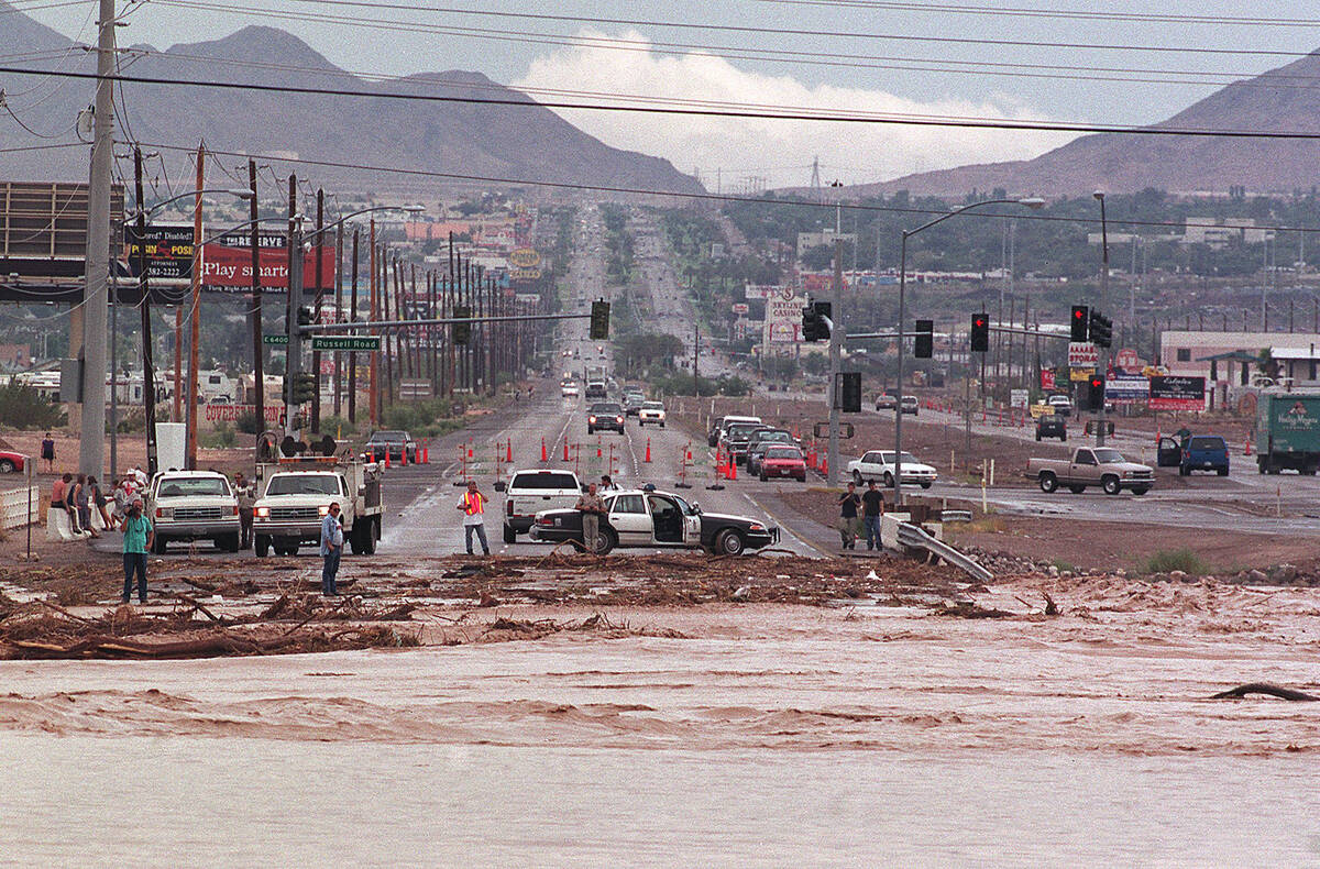 Floodwaters cross Boulder Highway just north of Russel Road on July 8, 1999. The road was block ...