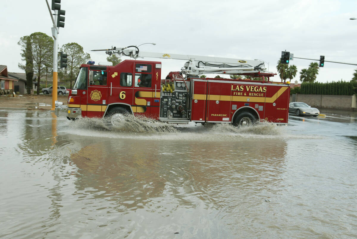 A Las Vegas Fire & Rescue fire truck drives through floodwaters in Las Vegas on Aug. 19, 2003. ...