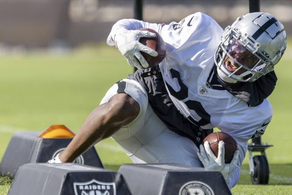 Raiders running back Kenyan Drake (23) works through a drill during the team’s training ...