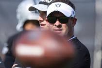 Raiders head coach Josh McDaniels watches his players during team's practice at training camp i ...