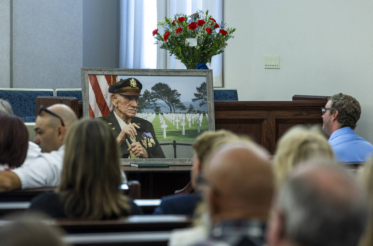 A portrait of Southern Nevada WW II veteran and POW Dean Whitaker is on display during the fune ...