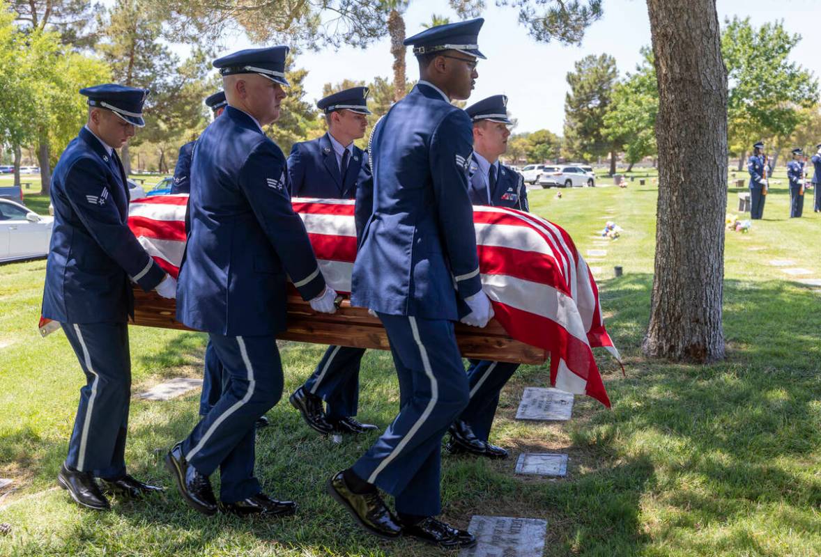 The Nellis Air Force Base Honor Guard carries the flag-draped coffin of Southern Nevada WW II v ...
