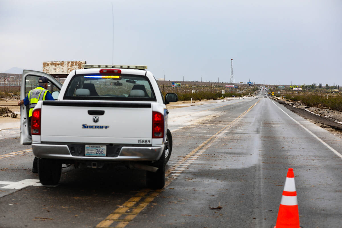A portion of washed out road from monsoonal flash floods in the region in Pahrump, Nev., Sunday ...