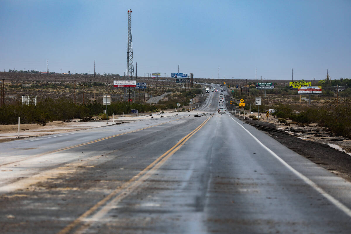 A portion of washed out road from monsoonal flash floods in the region in Pahrump, Nev., Sunday ...