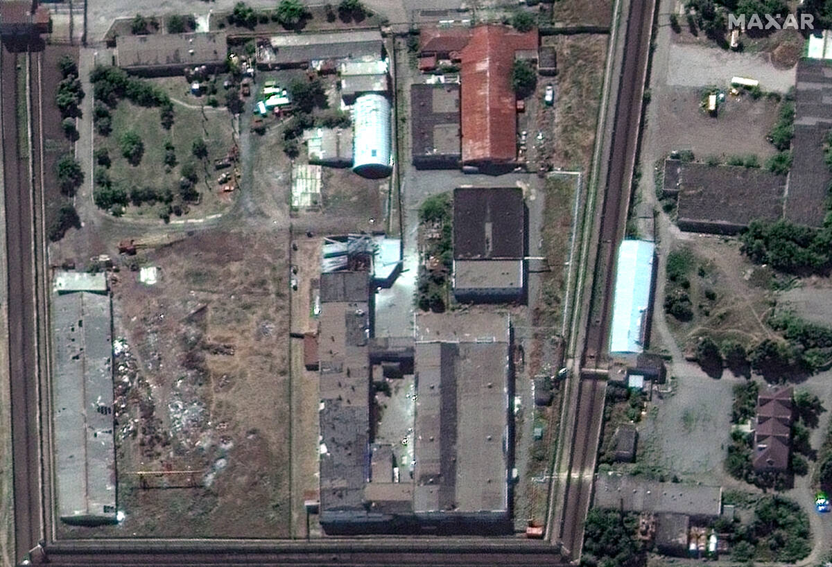 In this satellite photo provided by Maxar Technologies, a view of the Olenivka detention center ...