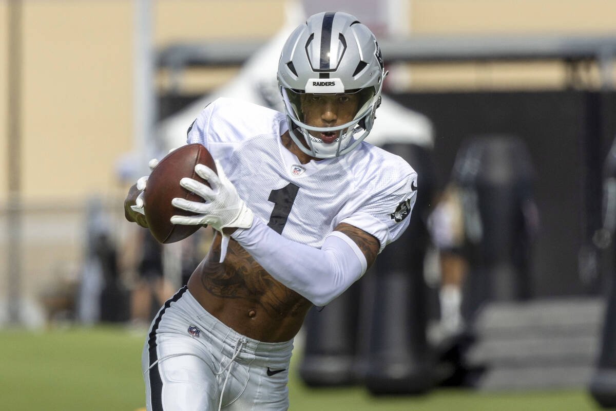 Raiders wide receiver Tyron Johnson (1) makes a catch during the team’s training camp pr ...