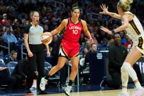 Kelsey Plum #10 of the Las Vegas Aces handles the ball during the game against the Indiana Feve ...