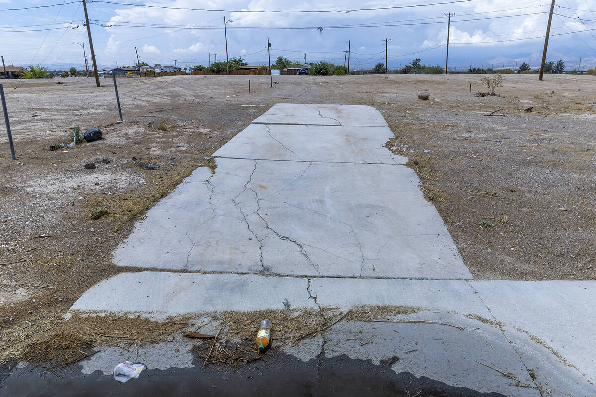 A former property with only foundation remaining off of North Chamberlain Lane within the Winds ...