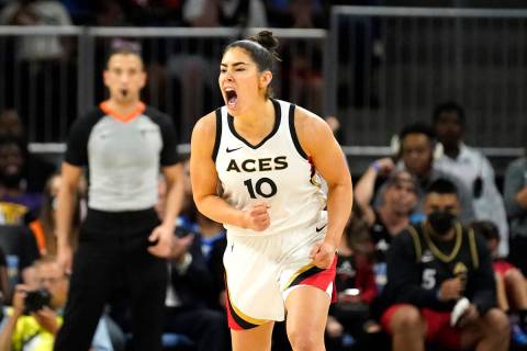 Las Vegas Aces' Kelsey Plum yells out after scoring during the second half of the WNBA Commissi ...