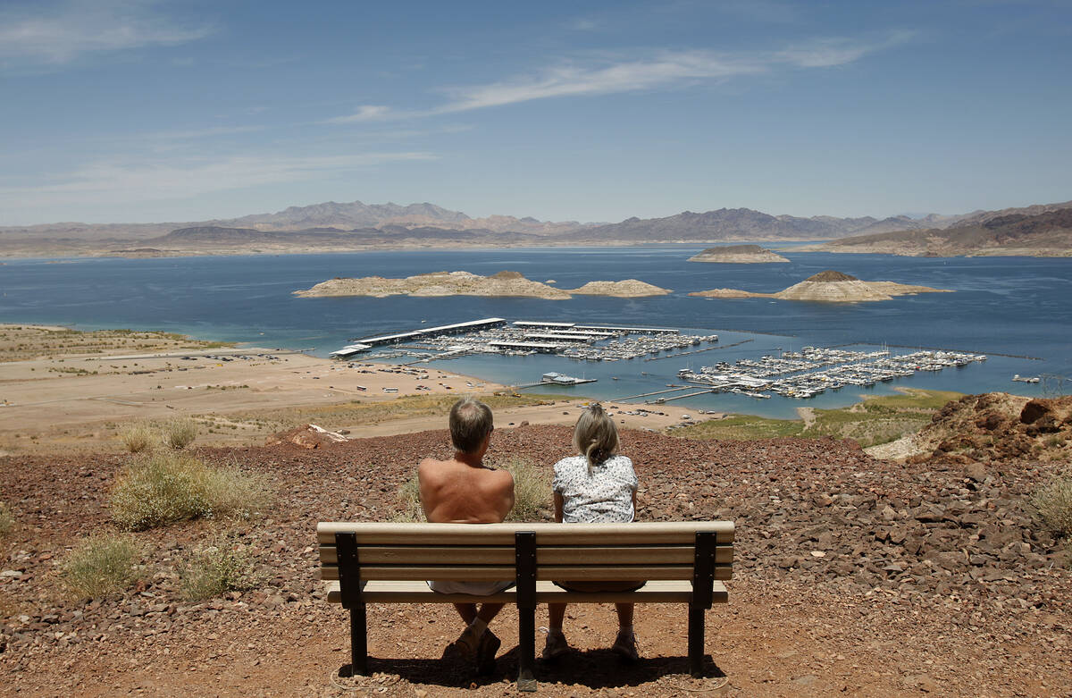 A couple takes a break along the Historic Railroad Trail overlooking Lake Mead Tuesday, May 25, ...