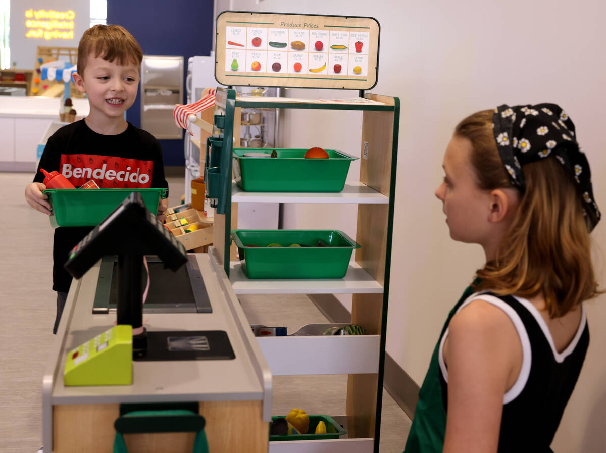 Atreyu Lozef, 4, plays with his sister, Lyric Lozef, at the newly opened Skyluna coworking and ...