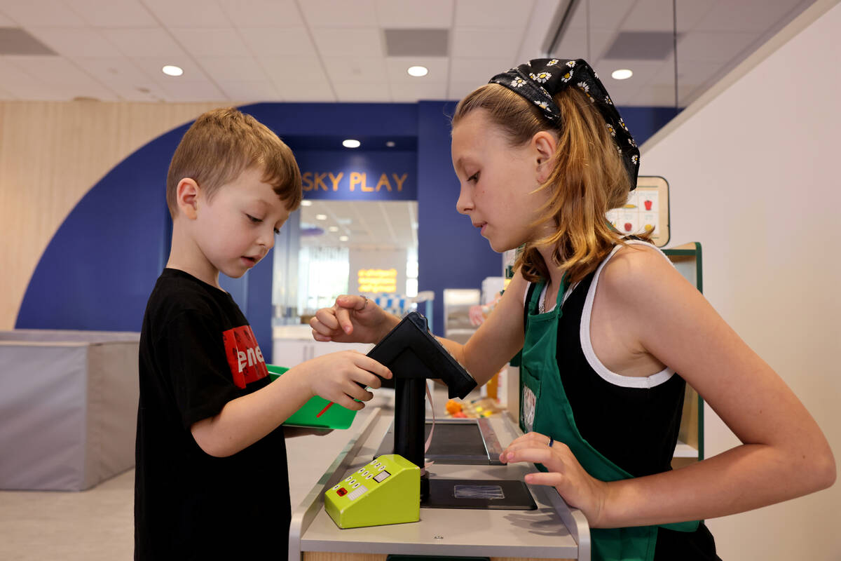 Atreyu Lozef, 4, plays with his sister, Lyric Lozef, at the newly opened Skyluna coworking and ...