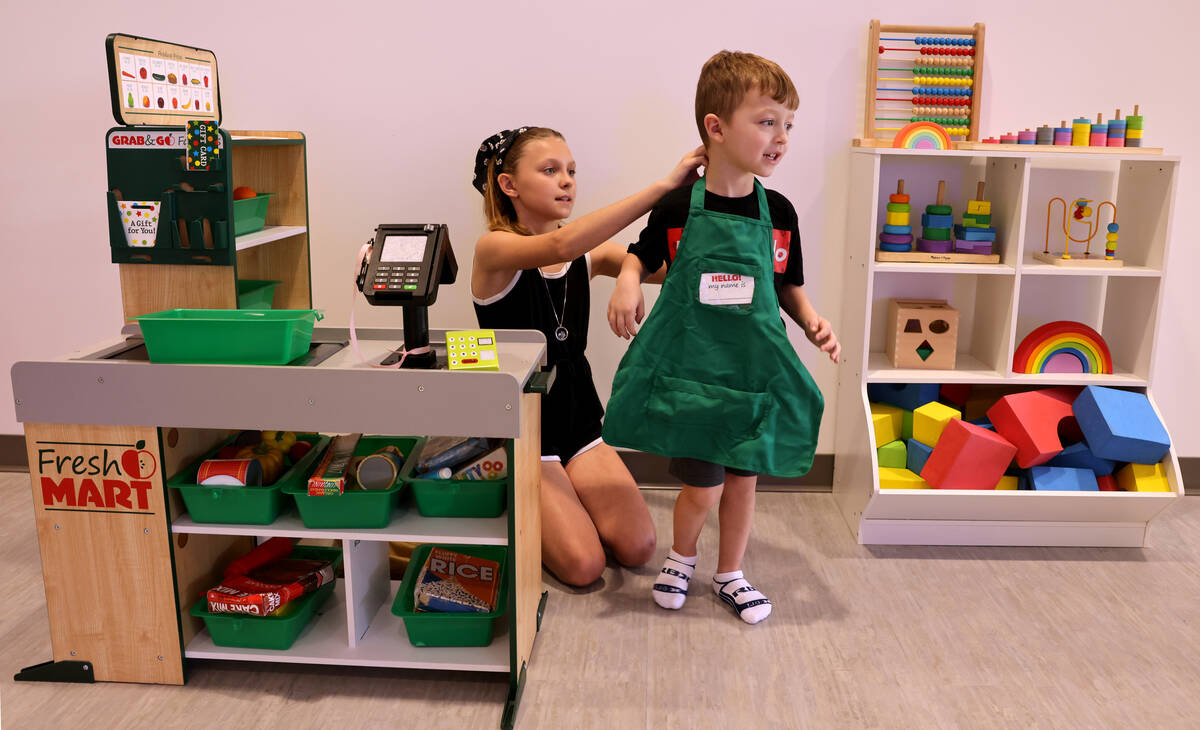 Atreyu Lozef, 4, plays with his sister, Lyric Lozef, at the newly opened Skyluna coworking and ...