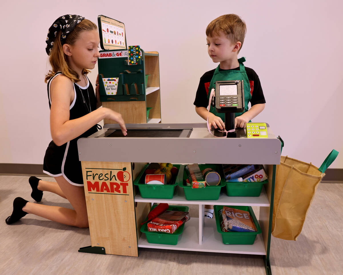 Atreyu Lozef, 4, plays with his sister, Lyric Lozef, at the newly opened Skyluna coworking and ...