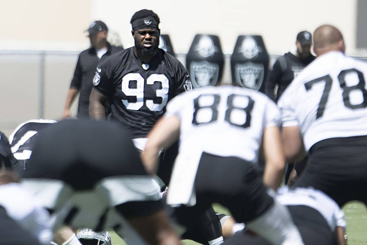 Raiders defensive tackle Neil Farrell, Jr. (93) stretches during the team’s mandatory mi ...