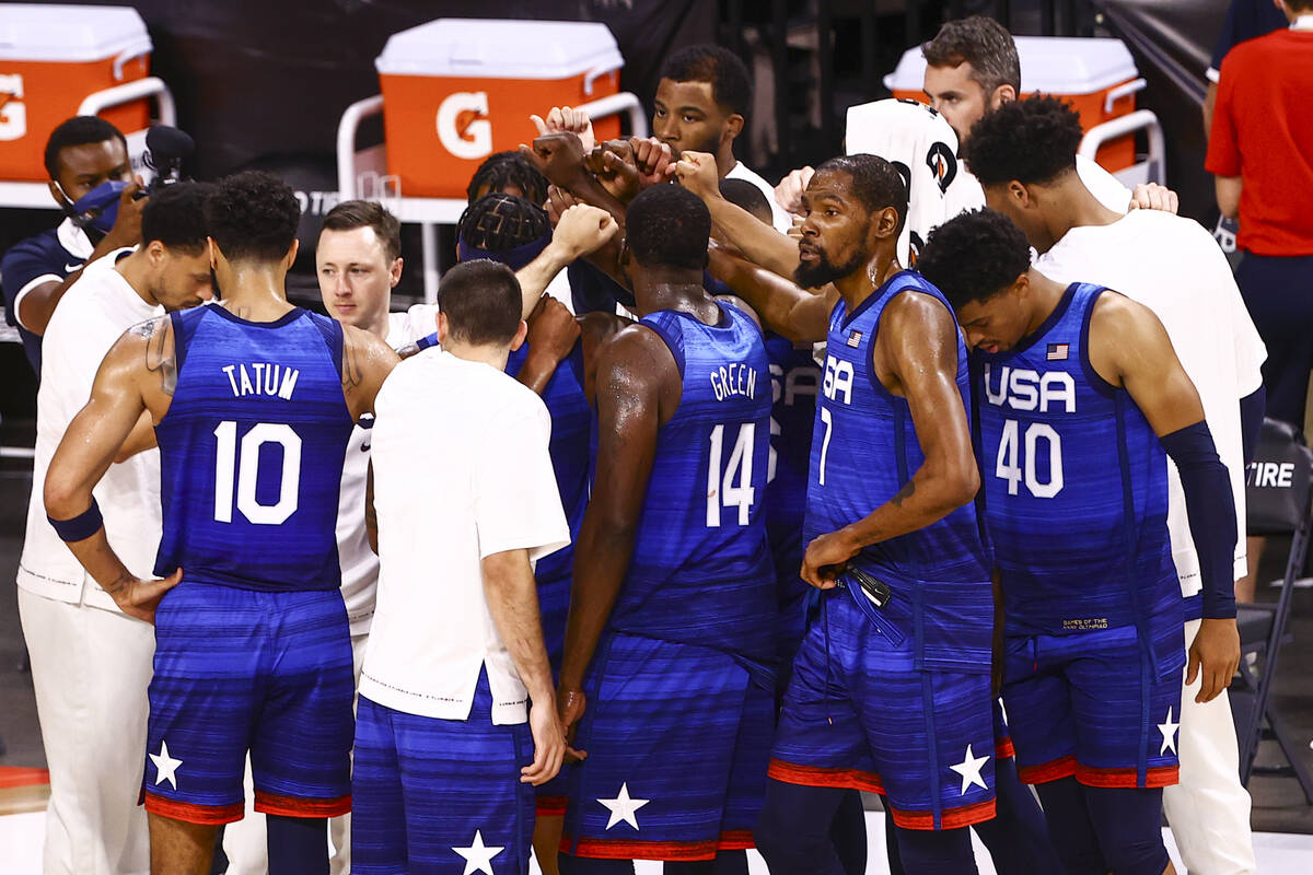 USA Basketball players huddle after losing to Australia in an exhibition basketball game ahead ...