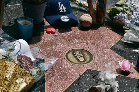 Baseball memorabilia is left at the star of Los Angeles Dodgers broadcaster Vin Scully along th ...