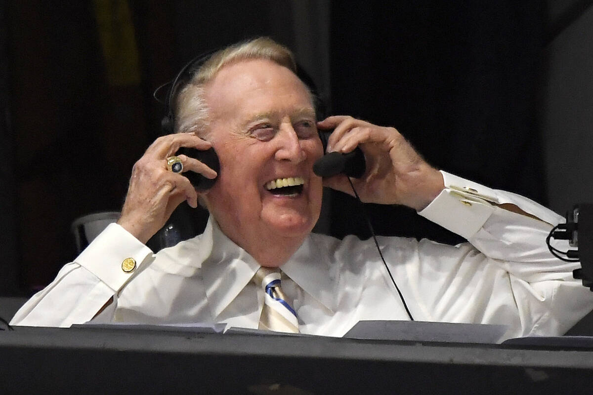 In this Monday, Sept. 19, 2016, file photo, Los Angeles Dodgers' Hall of Fame announcer Vin Scu ...
