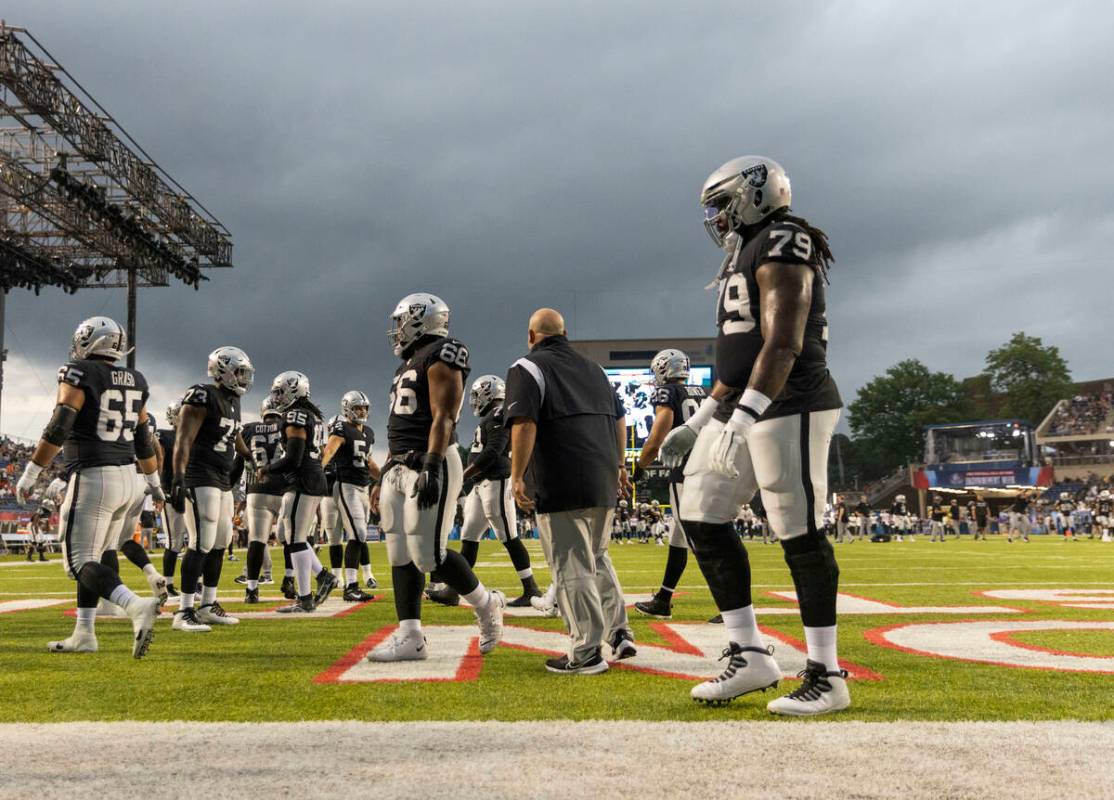 Raiders, from left, Hroniss Grasu (65), Matthew Butler (73), Kendal Vickers (95), Dylan Parham ...
