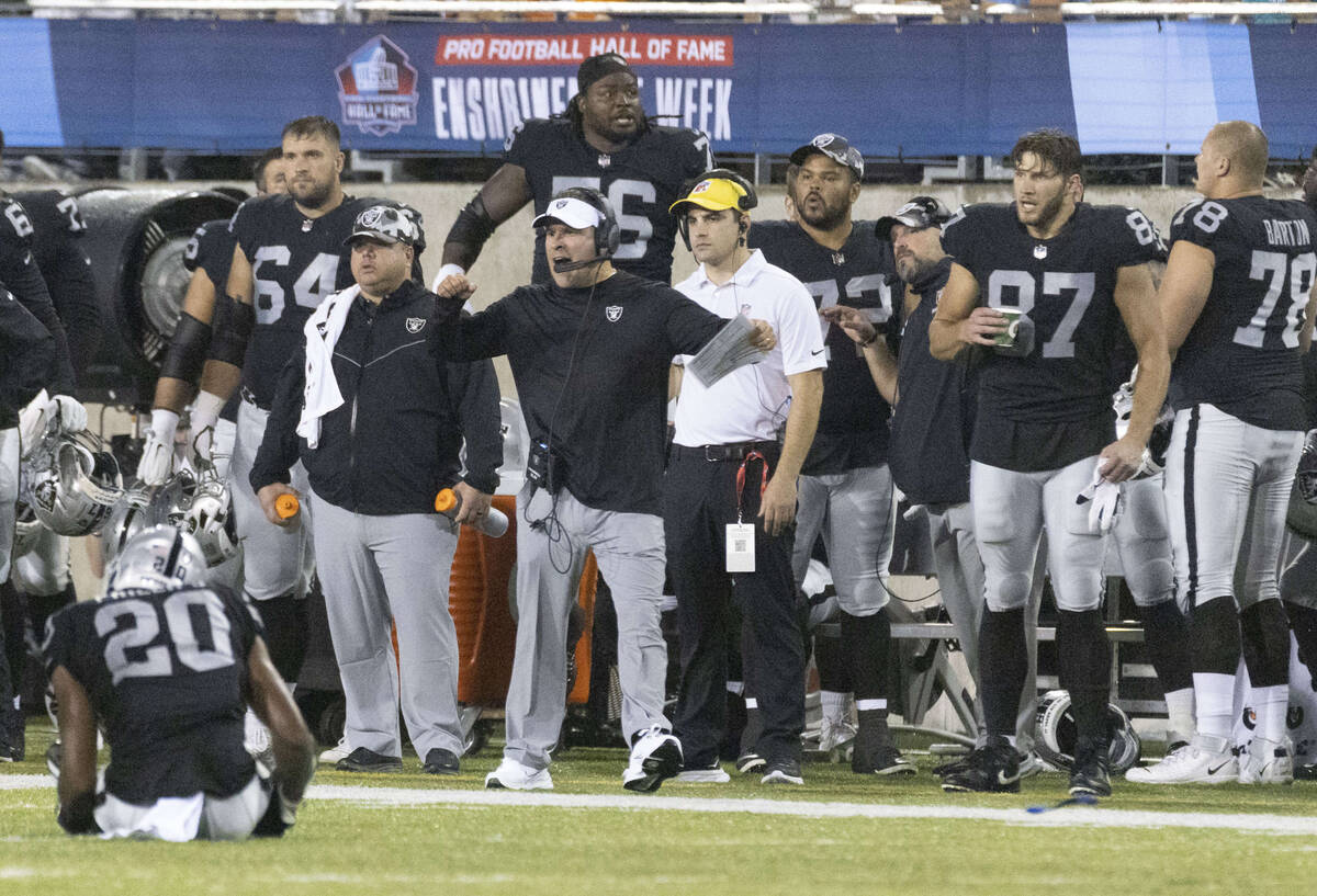 Raiders head coach Josh McDaniels cheers after the team secures a turnover during the first hal ...