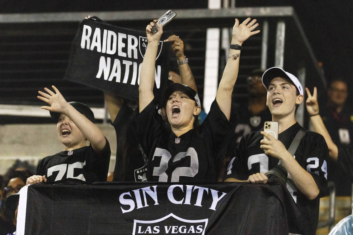 Raiders fans cheer during the first half of the NFL Hall of Fame game against the Jacksonville ...