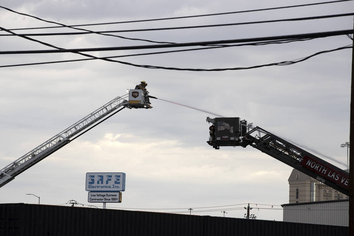 Las Vegas fire crews put out a fire at 2330 Industrial Road on Thursday, Aug. 4, 2022, in Las V ...