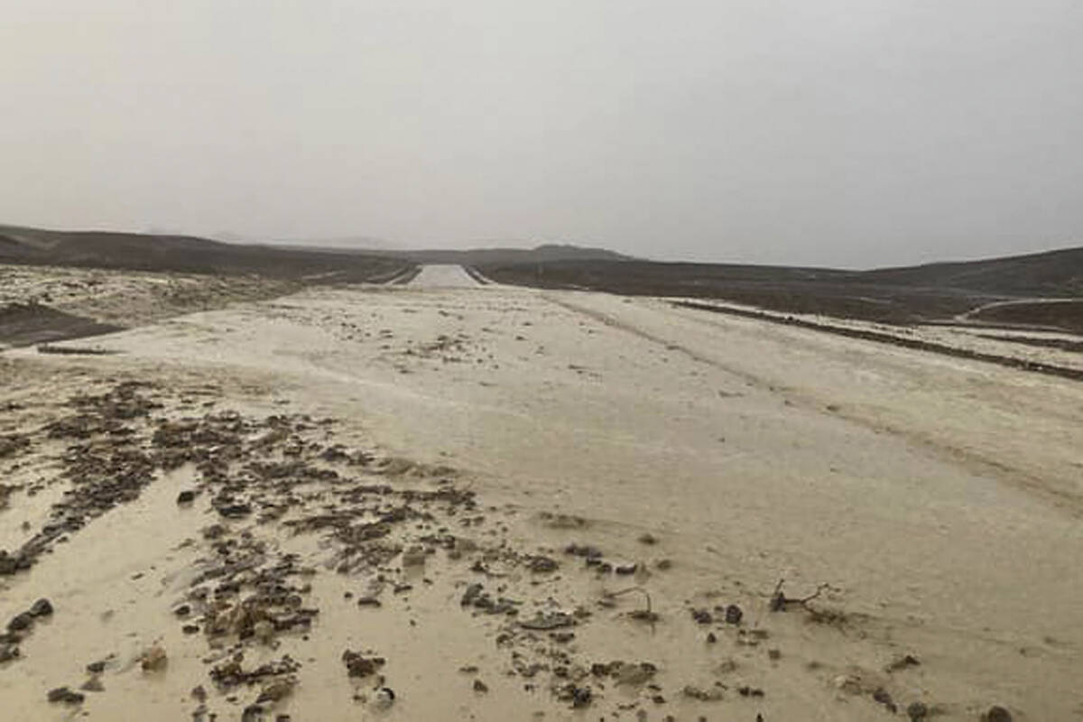 In this photo provided by the National Park Service, Highway 190 is closed due to flash floodin ...