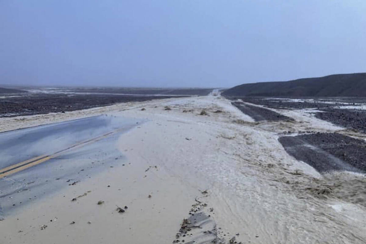 In this photo provided by the National Park Service, Highway 190 is closed due to flash floodin ...