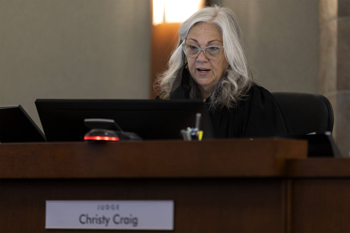 District Judge Christy Craig presides over a competency hearing for Michael Earl, a University ...