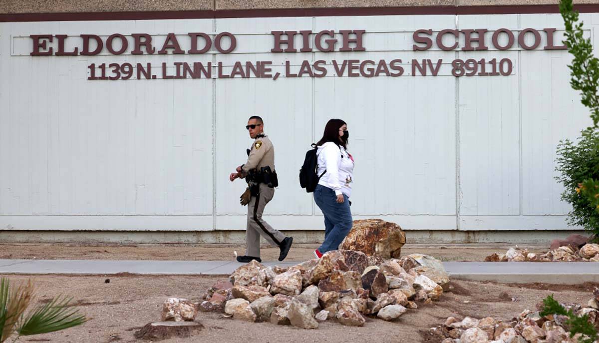 Las Vegas police officer Sebastian Hernandez Jr. patrols as students arrive for the first day o ...
