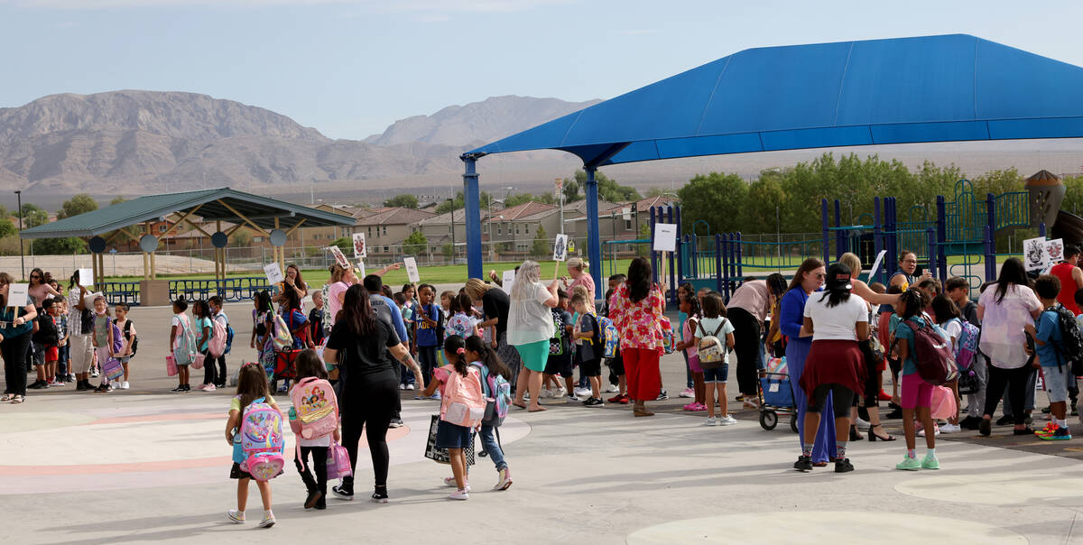 Students arrive for the first day of the school year at Hayden Elementary School in Las Vegas M ...