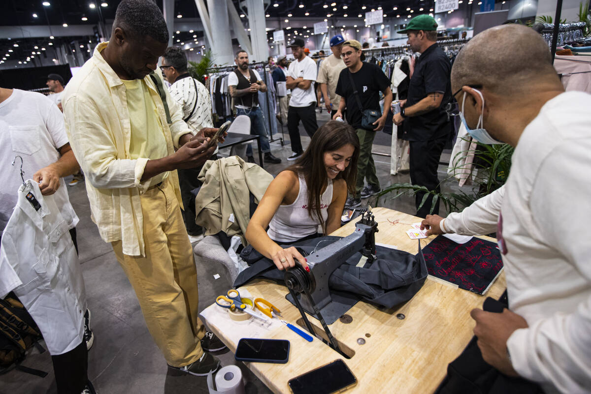 Brooke Jaramillo, owner of Large Lemonade, works on custom chainstitch embroidering during the ...