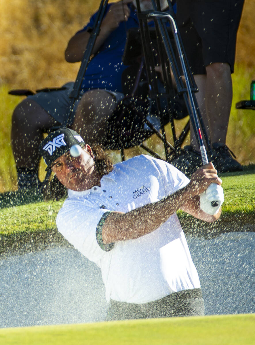 In this Oct. 6, 2019, file photo, Pat Perez blasts from the bunker and onto the green at hole 1 ...
