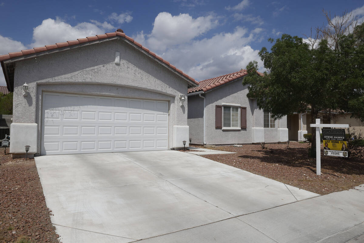 A sales sign is seen at 5653 Artesia Lake Court, Friday, Aug. 5, 2022, in Las Vegas. (Chitose S ...