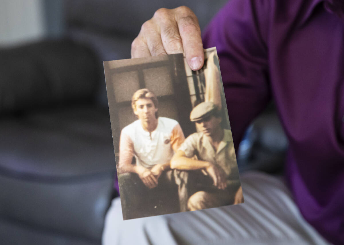 Michael DiVicino, former inmate and author, shows a photo of himself, left, with a relative on ...