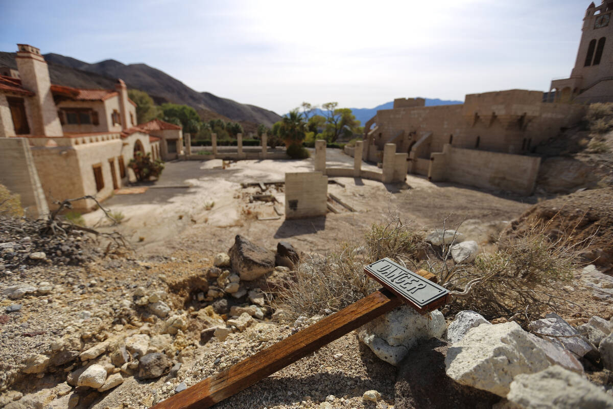 Journalists are taken on a tour to view the flooding damage done to Scotty's Castle in Death Va ...