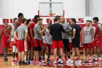 UNLV players huddle with their coaches during a team basketball practice at Mendenhall Center i ...