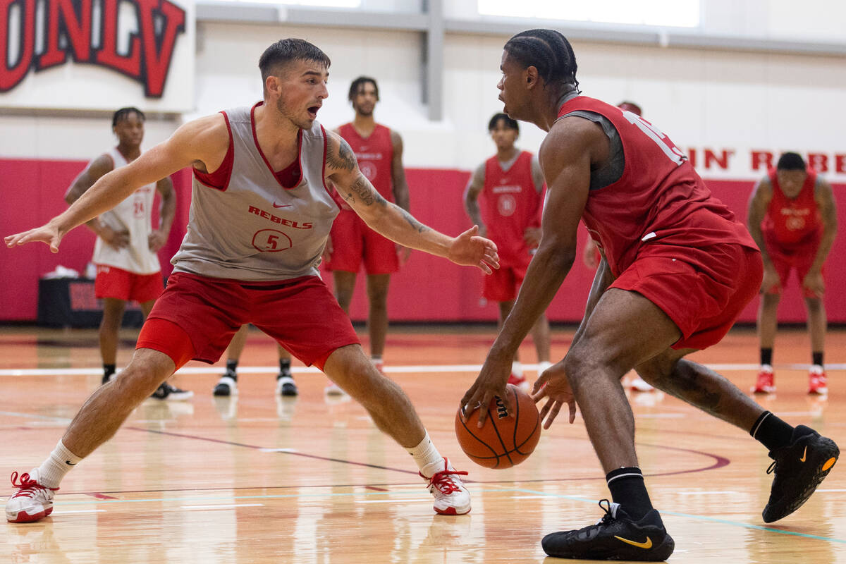 UNLV's Jordan McCabe (5) defends against Luis Rodriguez (15) during a team basketball practice ...