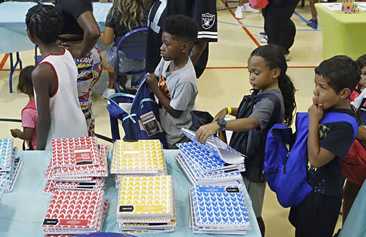 Students lineup for school supplies at the Whitney Recreation Center on Saturday, Aug. 6, 2022. ...
