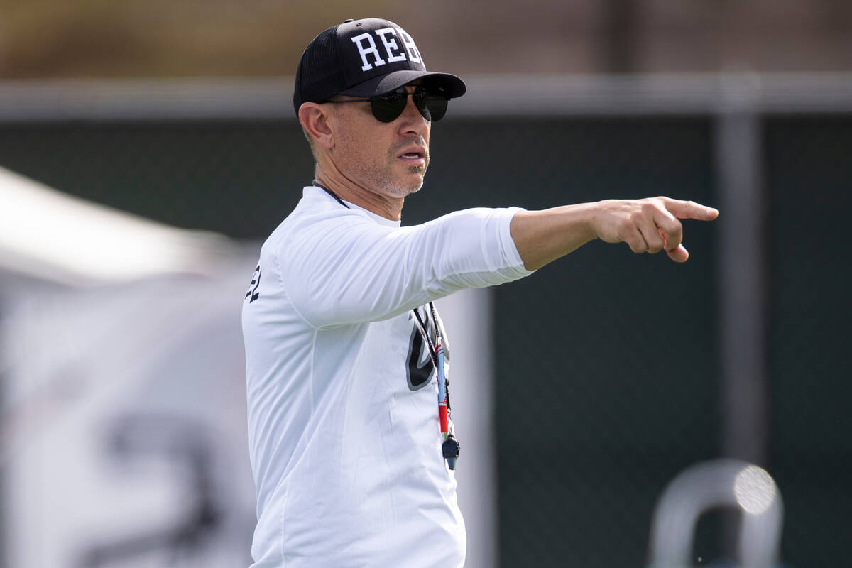 UNLV football coach Marcus Arroyo calls on his players players during a team practice at UNLV i ...