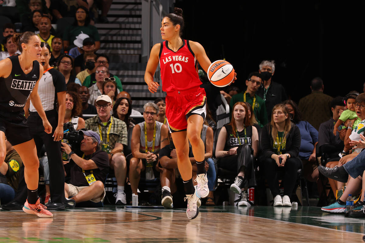 Kelsey Plum #10 of the Las Vegas Aces dribbles the ball during the game against the Seattle Sto ...
