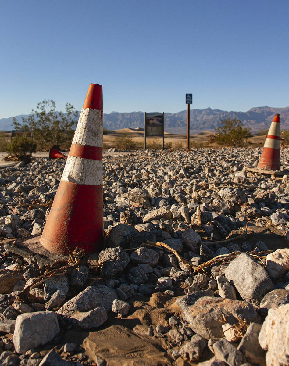 Rocks left behind from flash flooding covers parking lot at Mesquite Flat Sand Dunes in Death V ...