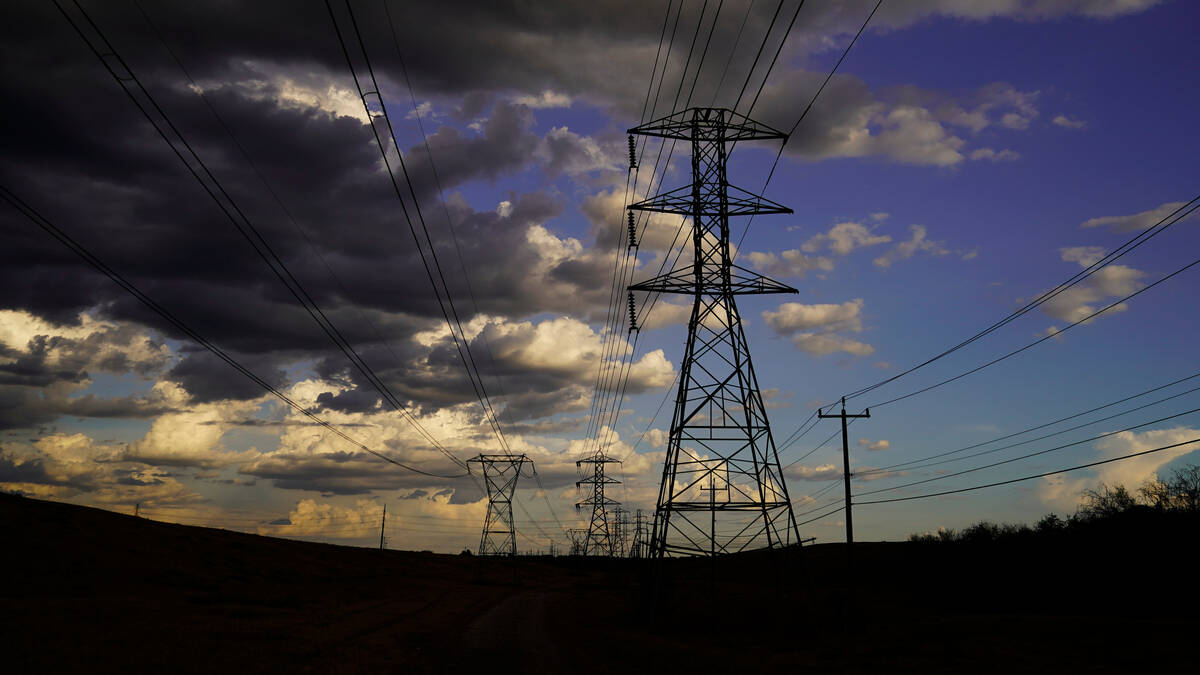 Power lines are seen under a cloudy sky, Wednesday, Aug. 10, 2022, in San Antonio. (AP Photo/Er ...