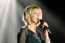 Singer Olivia Newton-John performs Saturday, July 31, 1999, in Reno, Nev. (AP Photo/David Hunter)