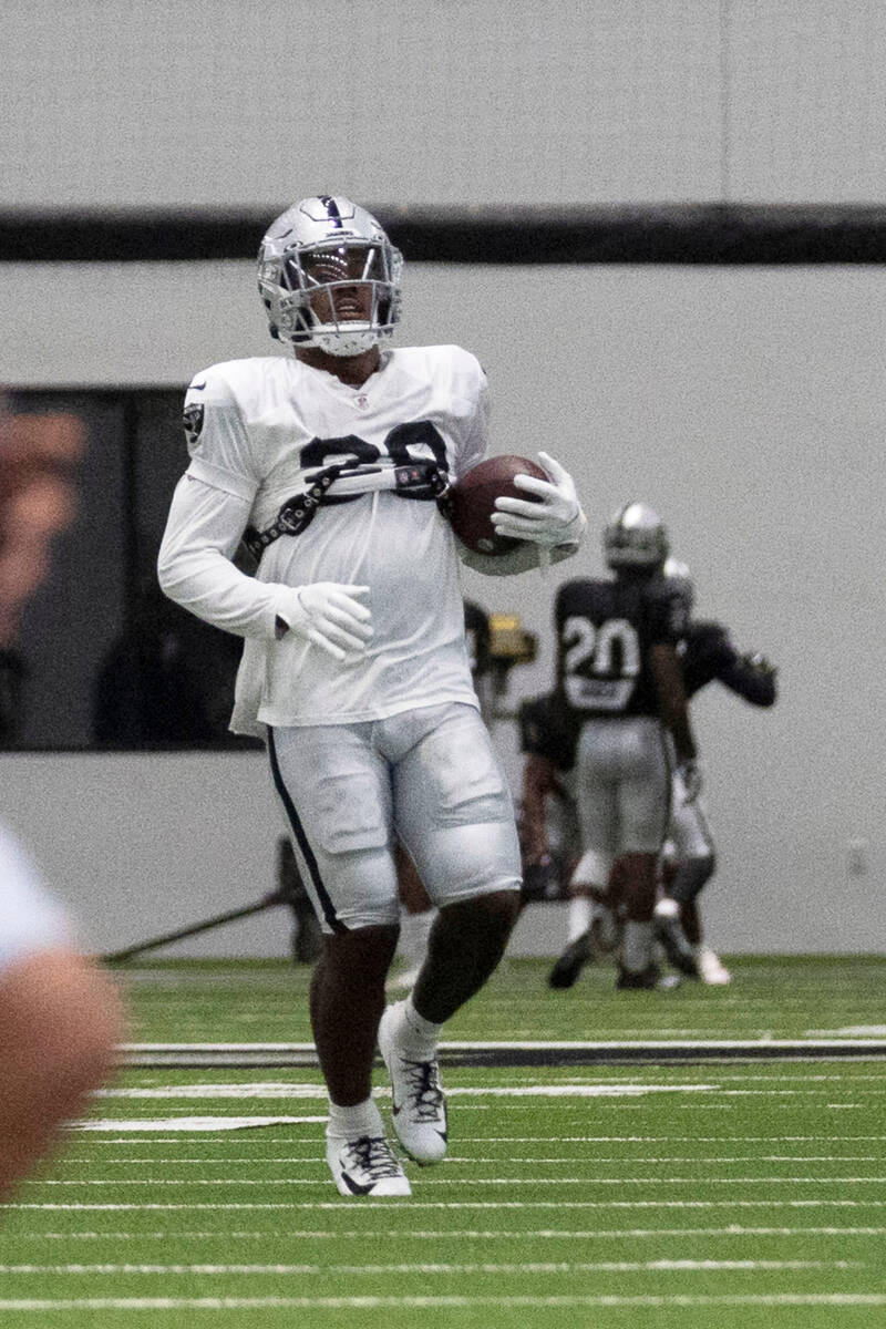 Raiders running back Josh Jacobs (28) runs during a drill at the team’s training camp pr ...