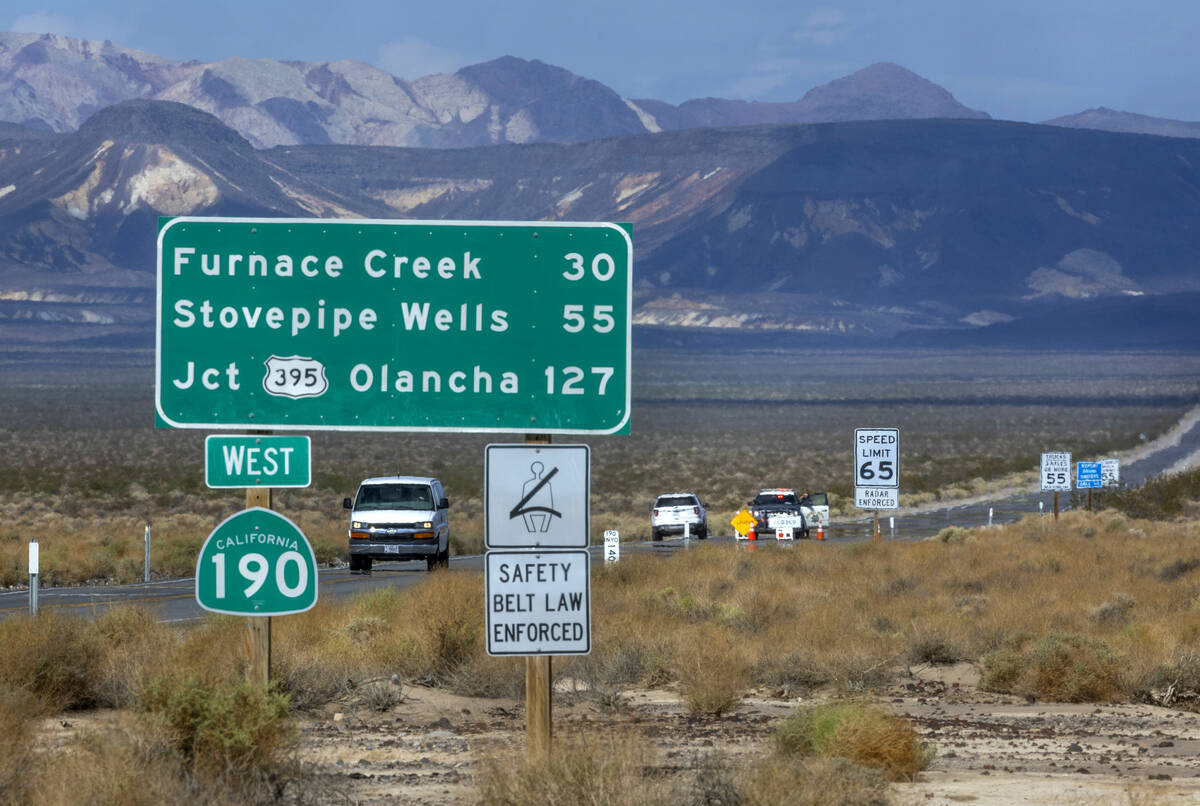 A roadblock remains on State Route 190 leading into Death Valley National Park following monsoo ...