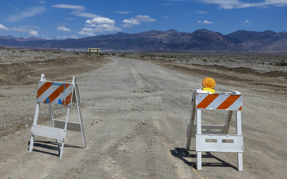 Severe road damage along Beatty Road has it temporarily closed due to the effects of recent flo ...