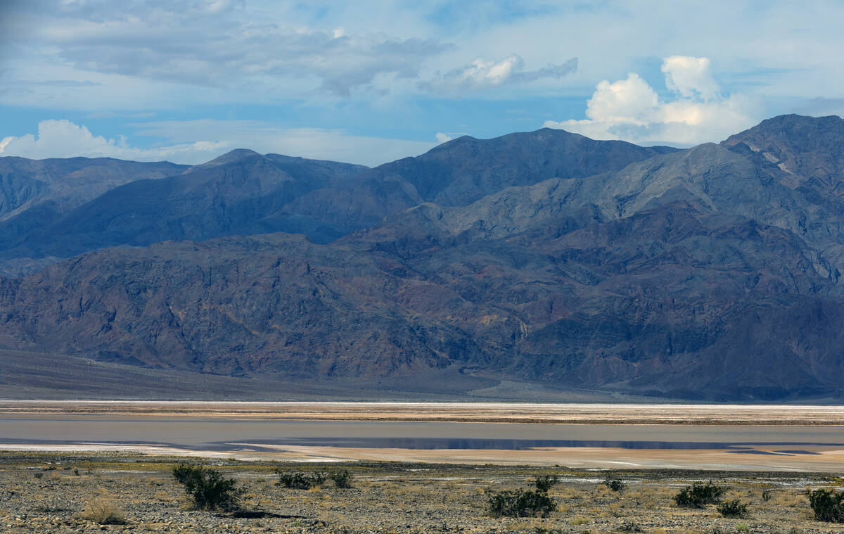 Water collects into a large pond about the lowest part of Death Valley National Park off on Sta ...